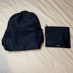 Tumi Backpack and makeup case for travel mettalic blue